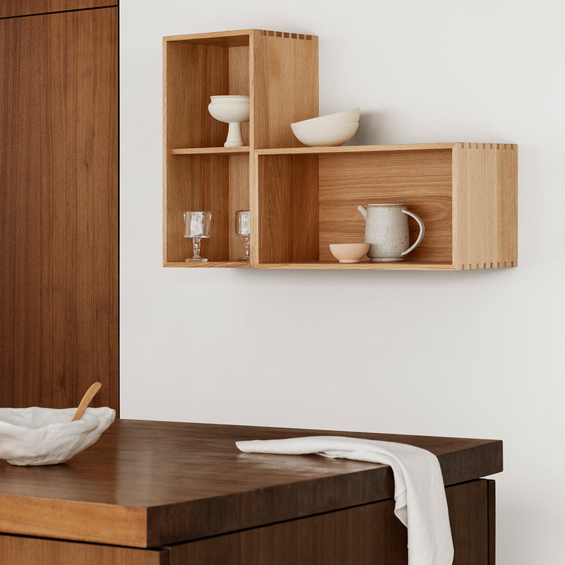 Natural wood wall shelf with light brown finish, featuring simple, clean lines and empty sections for decorative display.