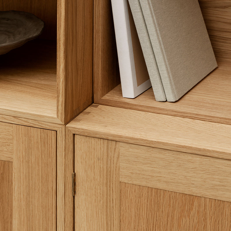 Natural oak finish with smooth surfaces, featuring clean lines and minimalist design. Neutral tones with subtle texture.