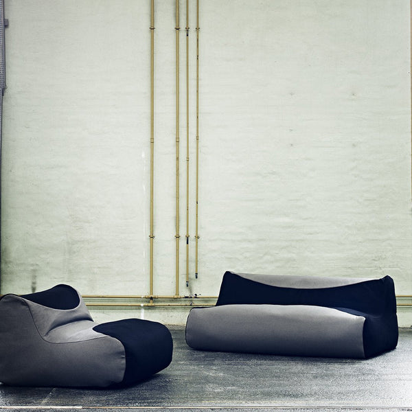Modern bean bags featuring a sleek gray and black color scheme with smooth, minimalist patterns.