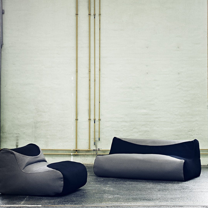 Modern bean bags featuring a sleek gray and black color scheme with smooth, minimalist patterns.