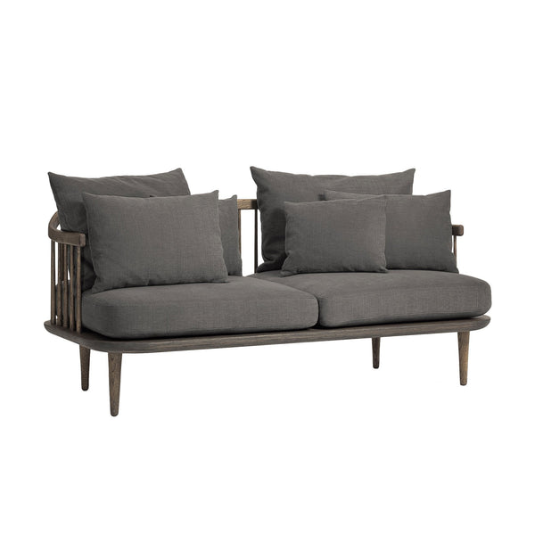 Grey upholstered sofa with multiple matching cushions and a sleek wooden frame. Modern, minimalist design.