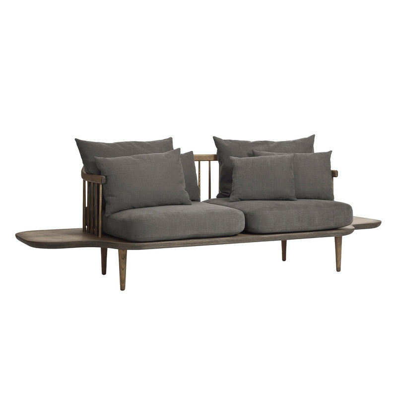 Dark gray fabric sofa with plush cushions and a minimalist wooden frame. Clean lines and modern design.