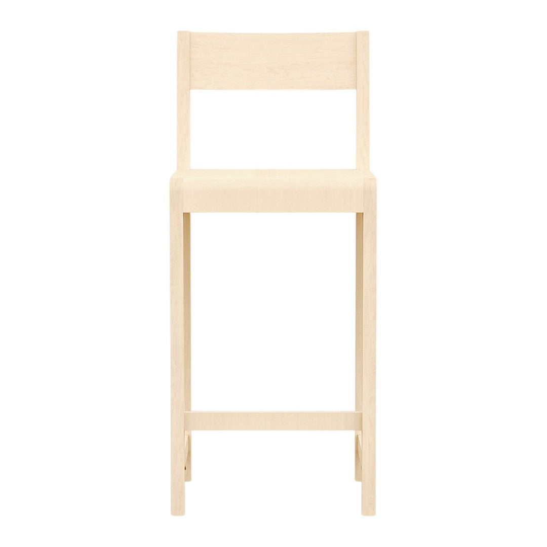 Natural wood color bar stool with a minimalist design and smooth, clean lines. Perfect for modern decor.