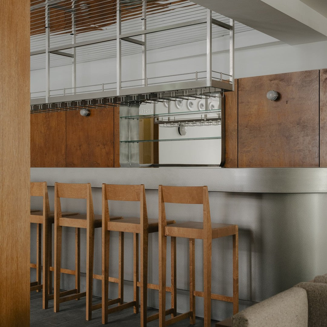 Modern kitchen with warm wood tones, sleek stainless steel, and minimalist design. Ideal for contemporary spaces.