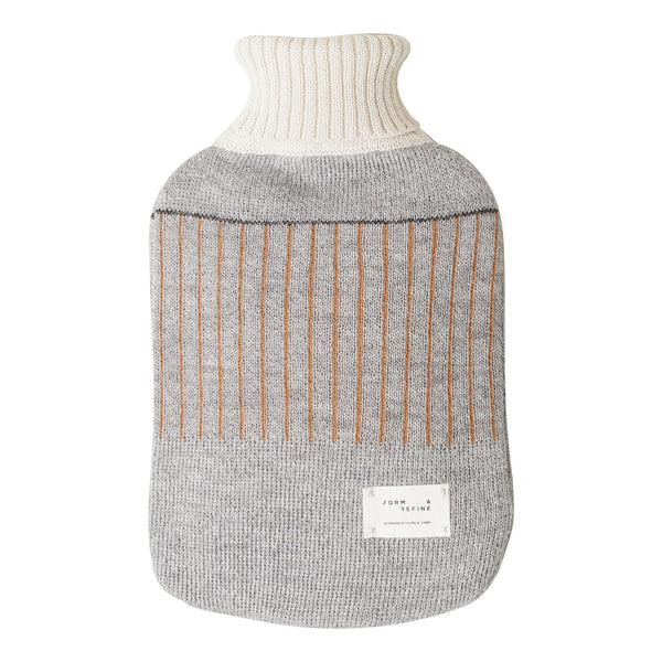 Grey and cream knitted hot water bottle with vertical brown stripes, featuring a ribbed neck. Perfect for cozy warmth.