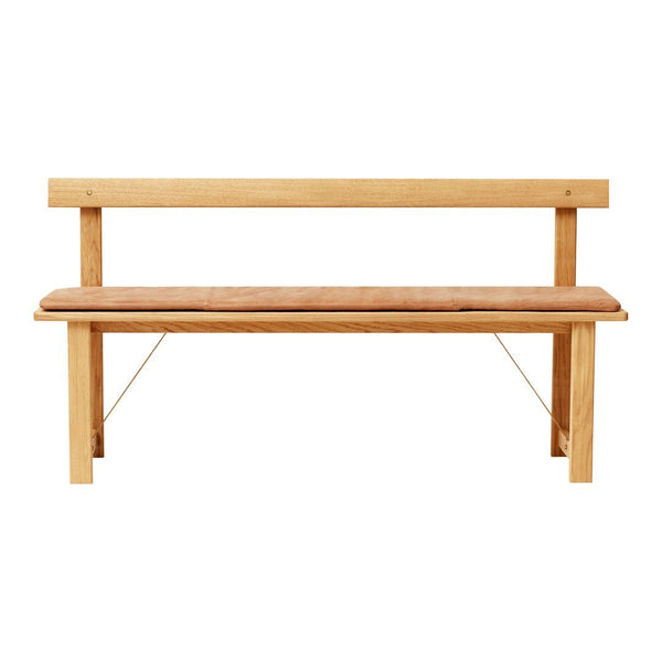 Light wood bench with a natural finish and a complementary tan cushion, featuring clean lines and minimalistic design.