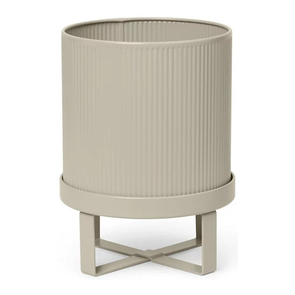 Beige ribbed planter with a stylish stand, featuring subtle texture and a modern design. Perfect for any decor.