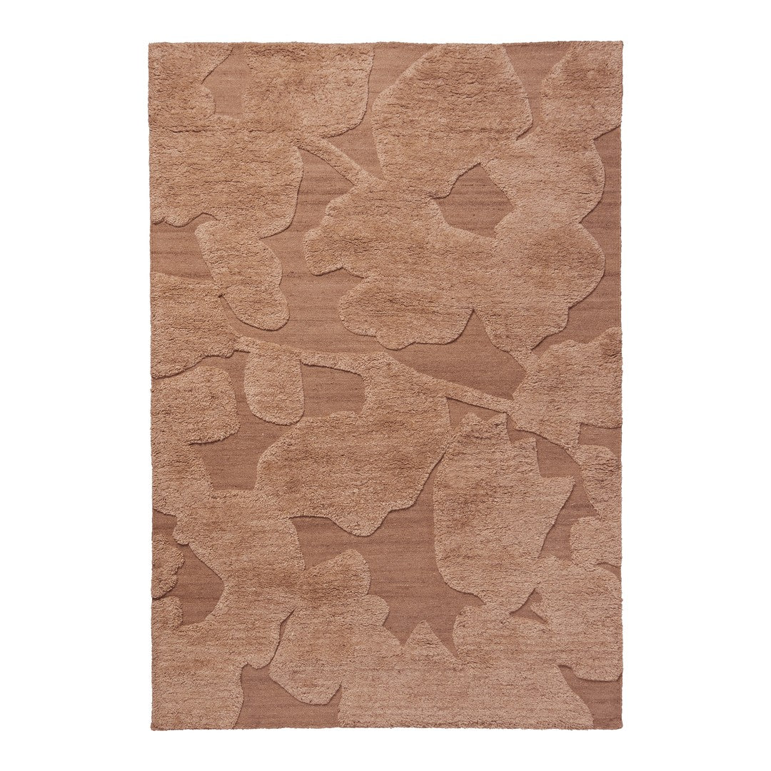 Beige area rug with subtle floral pattern in varying shades of tan and brown. Soft textured surface for cozy comfort.