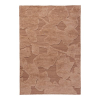 Beige area rug with subtle floral pattern in varying shades of tan and brown. Soft textured surface for cozy comfort.