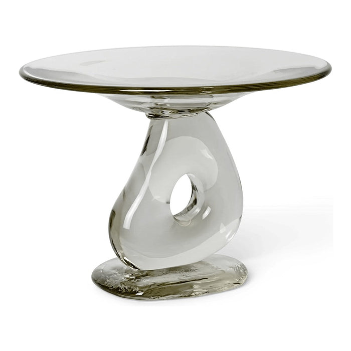 Elegant clear glass cake stand with a sleek, modern design and a smooth, flowing shape. Perfect for display.
