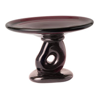 Elegant black and deep purple ceramic cake stand with a glossy finish and unique swirl pattern.