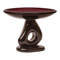 Deep burgundy and glossy black ceramic pedestal bowl with a unique swirl design. Perfect for decor or serving.