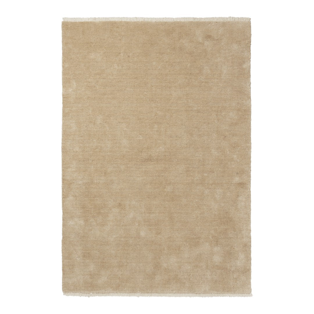 Beige area rug with a soft, smooth texture and minimalistic design, perfect for modern interiors.