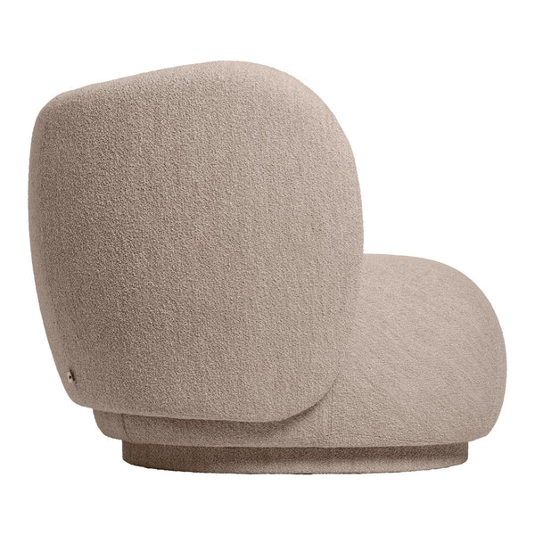 Stylish beige upholstered chair with a soft texture and rounded contours, perfect for modern decor.