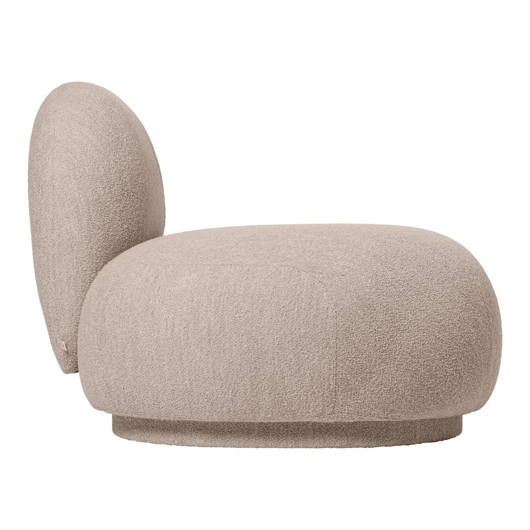 Beige upholstered chair with a rounded back, featuring a soft texture and minimalist design. Perfect for modern interiors.