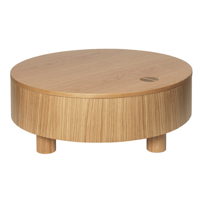Round wooden coffee table with a natural oak finish and subtle grain patterns, featuring tapered legs.