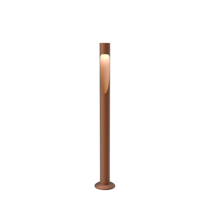 Tall, sleek floor lamp in warm bronze finish with a minimalist design and smooth surface. Ideal for modern decor.
