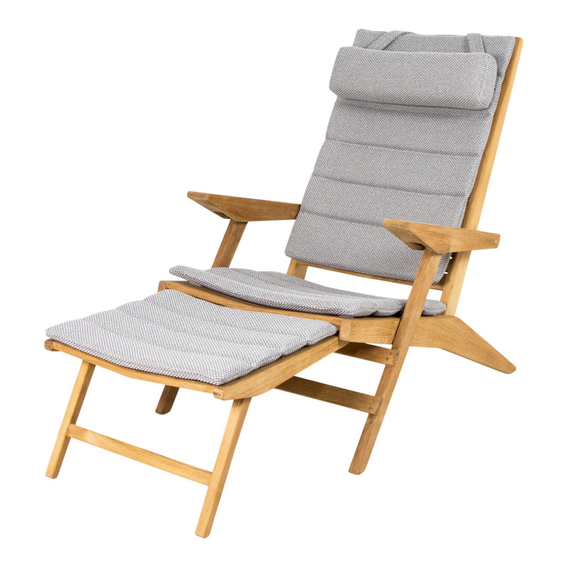Gray patterned cushions on a natural wood reclining chair with adjustable leg rest for stylish comfort.