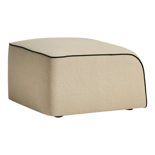 Beige upholstered ottoman with black piping detail and clean, modern lines. Ideal for contemporary decor.