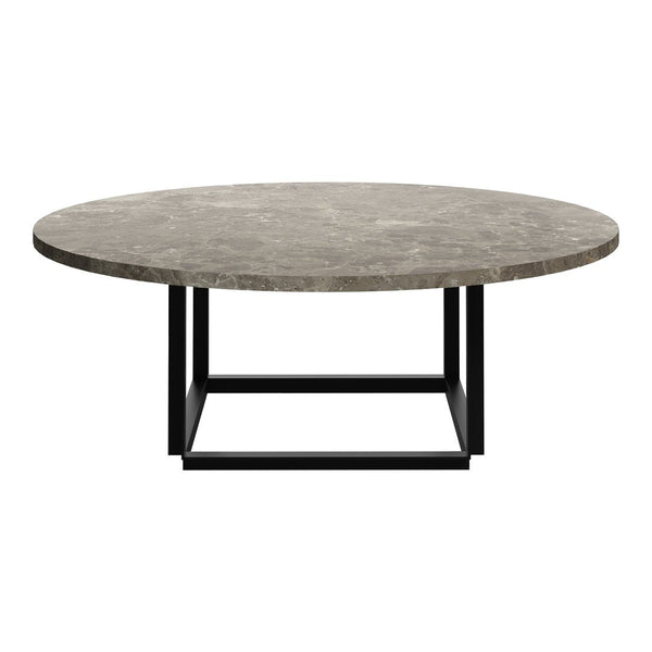 Round coffee table with a textured gray marble top and a sleek black metal base. Stylish and modern design.