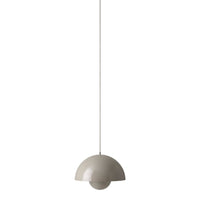Modern pendant light in soft beige with a minimalist dome shape and a smooth finish for a chic decor accent.