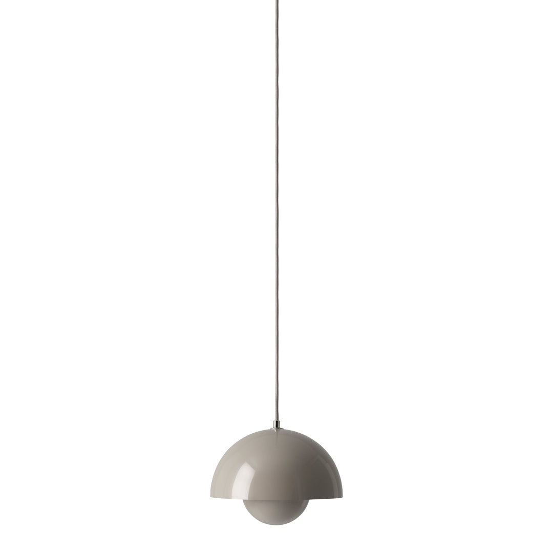 Sleek beige pendant lamp with a smooth, modern half-sphere design hanging from a thin wire.