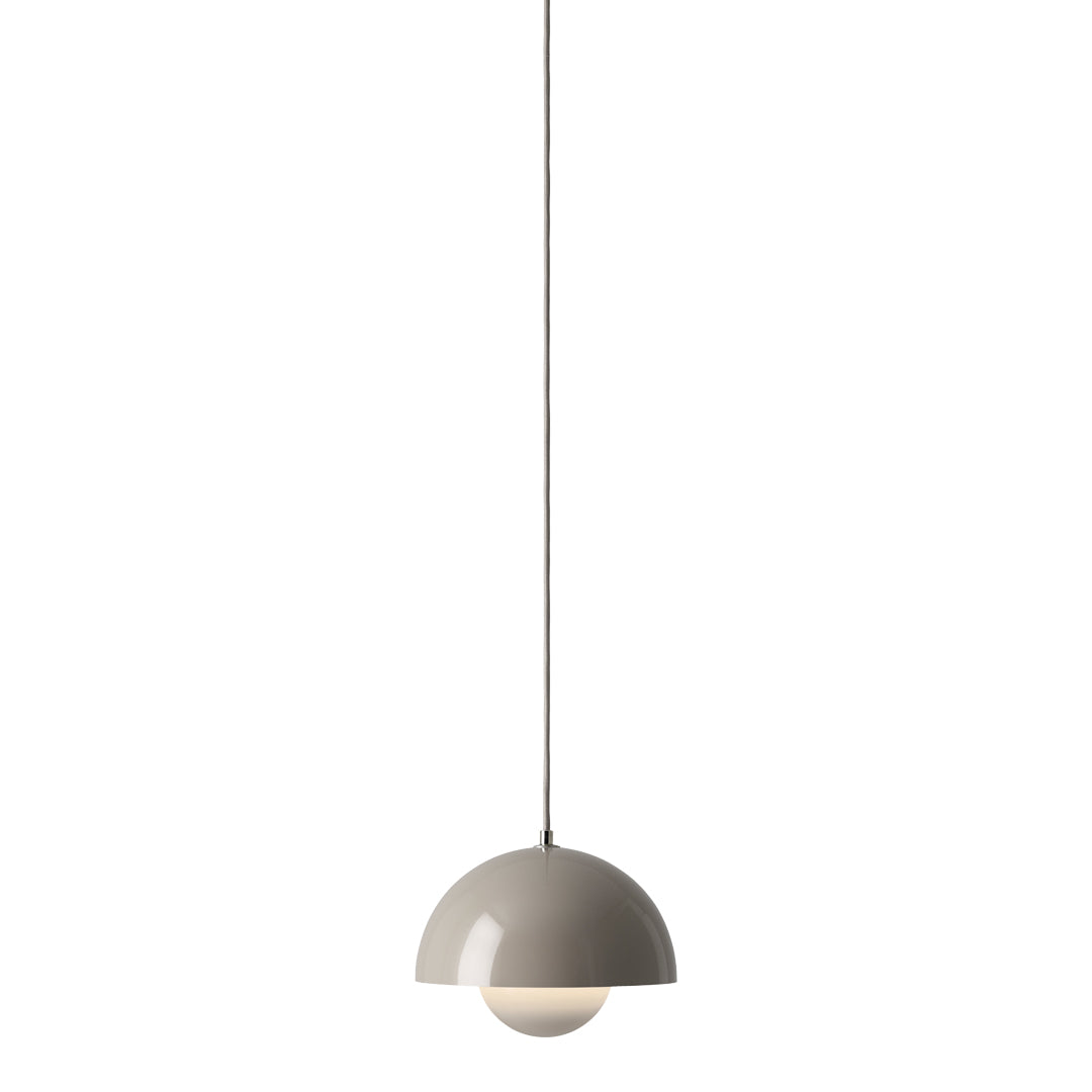 Beige half-dome pendant light with a glossy finish and a smooth circular design, suspended by a thin cable.