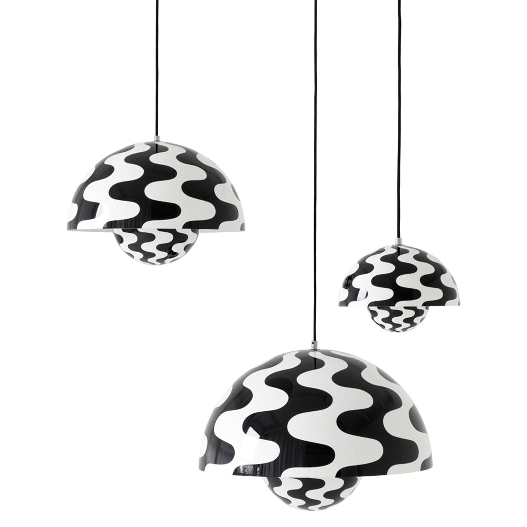 "Three hanging pendant lights featuring a bold black and white wavy pattern for modern decor."