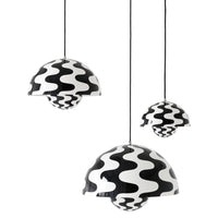 "Three hanging pendant lights featuring a bold black and white wavy pattern for modern decor."