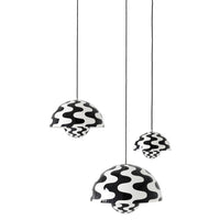 Black and white pendant lamps with wavy patterns, featuring three varying sizes for a stylish, modern accent.