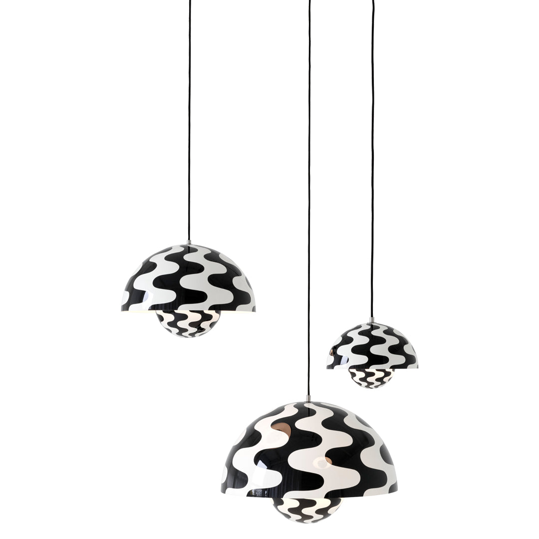 Black and white pendant lamps with wavy patterns, adding modern flair to any space.