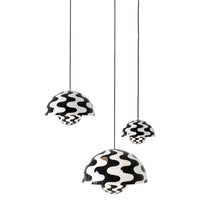 Black and white pendant lamps with wavy patterns, adding modern flair to any space.