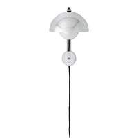 White contemporary wall lamp with a smooth rounded design and sleek black cord. Ideal for modern interiors.