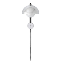 White contemporary wall lamp with a smooth rounded design and sleek black cord. Ideal for modern interiors.