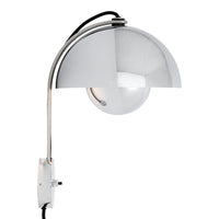 Chrome arch lamp with a sleek, metallic finish and a glossy white sphere, exhibiting a modern minimalist design.