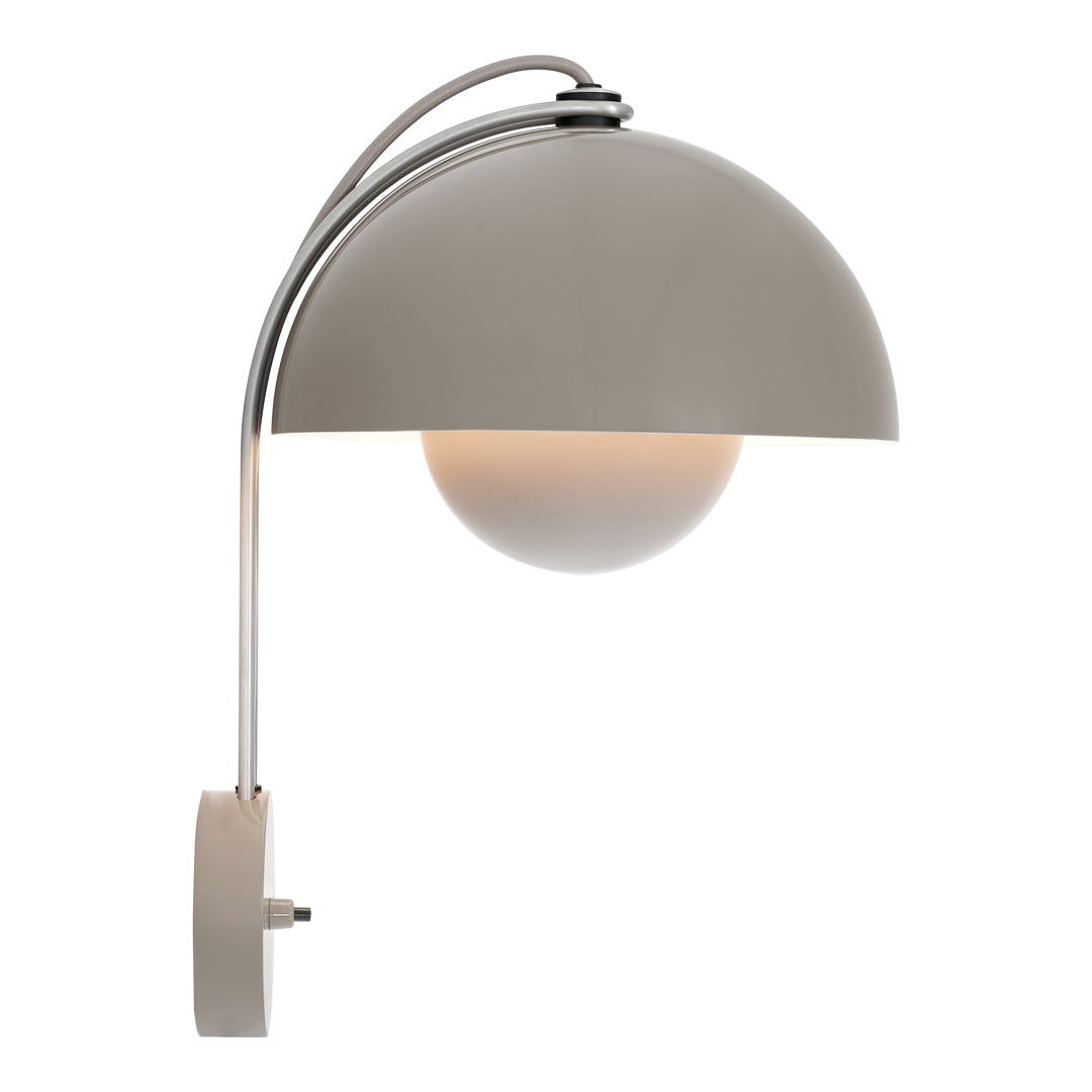 Modern wall lamp with a smooth gray shade and a chrome arch, featuring a round white glass bulb.