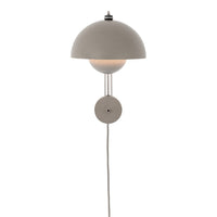 Modern wall lamp with a sleek gray dome shade and minimalist design, featuring smooth, soft curves and clean lines.