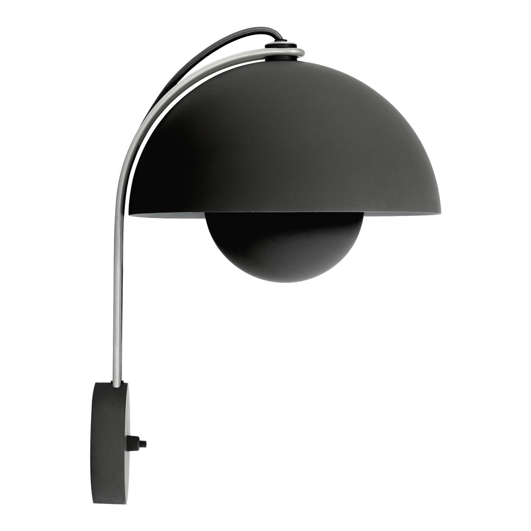 Sleek black lamp with smooth curves and a glossy finish, featuring a minimalist design and chrome accents.