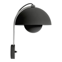 Sleek black lamp with smooth curves and a glossy finish, featuring a minimalist design and chrome accents.