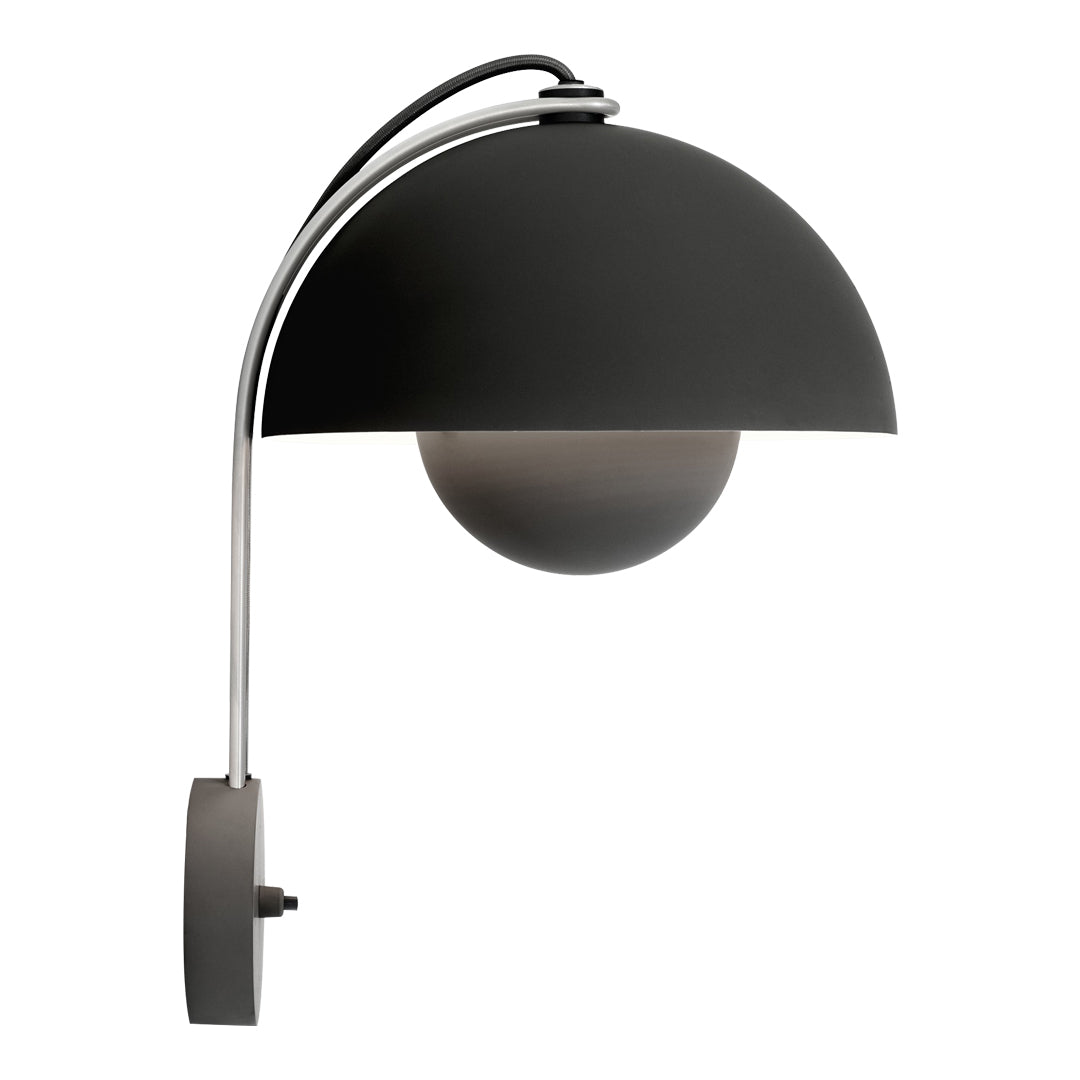Black metal wall lamp with a sleek, curved design and a round white globe, featuring a modern minimalist aesthetic.