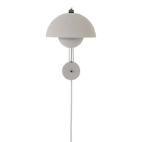 White dome wall lamp with sleek minimalist design and smooth finishes, perfect for modern decor styles.