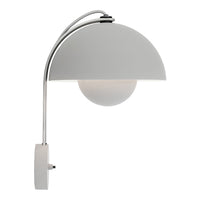 Sleek white lamp with a curved chrome arm and a round frosted glass globe, featuring a minimalist design.