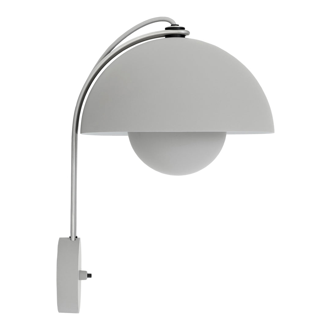 Modern wall lamp in matte white with a sleek, curved design and glossy globe shade, perfect for contemporary decor.
