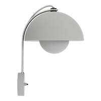 Modern wall lamp in matte white with a sleek, curved design and glossy globe shade, perfect for contemporary decor.