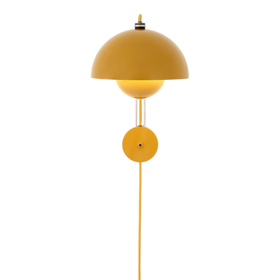 Yellow dome-shaped wall lamp with a sleek design and matching cord, offering a bright pop of color for modern spaces.
