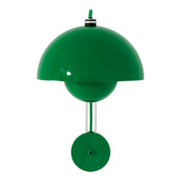"Green dome-shaped lamp with a matching round base and sleek metal accents, perfect for modern decor."