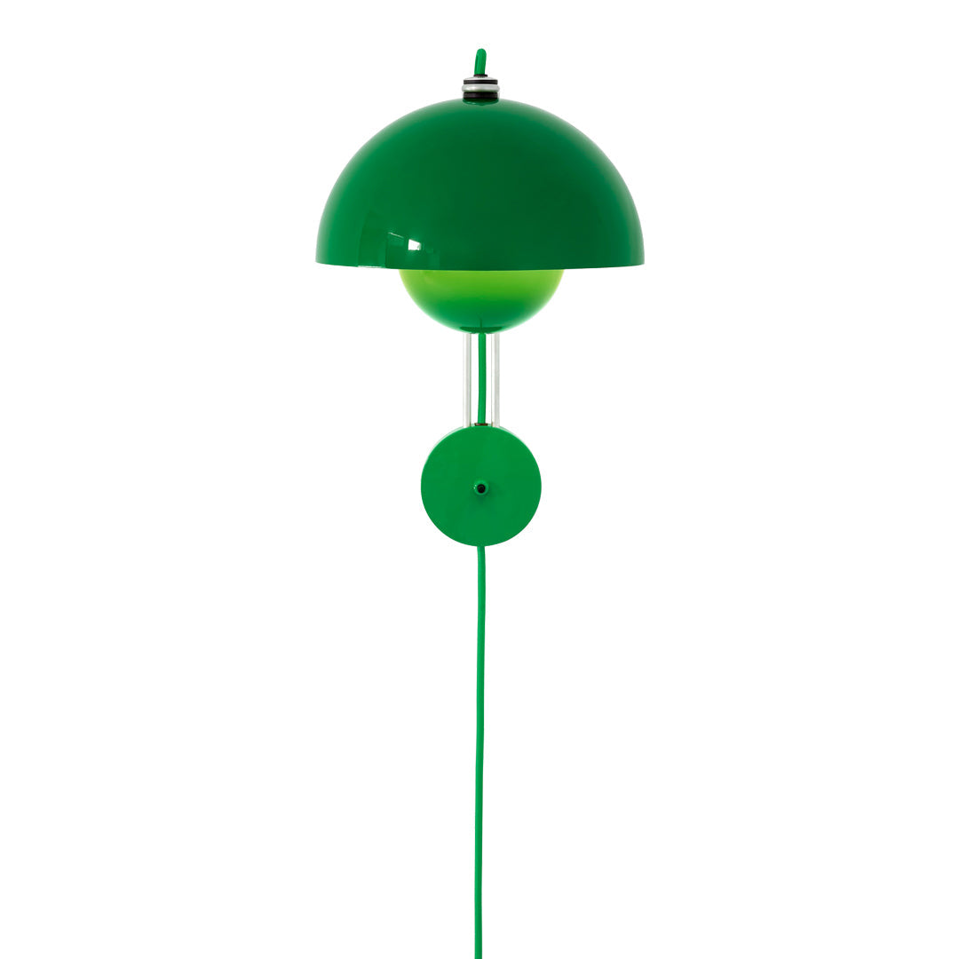 Green pendant lamp with a glossy dome shade and matching round base, featuring a sleek, modern design.