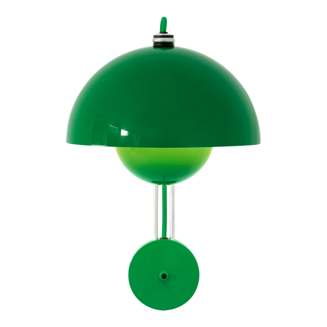 Green dome-shaped lamp with a bright green globe and circular base, creating a modern, playful design.