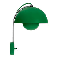 Green dome-shaped lamp with a shiny chrome base and sleek, modern design. Ideal for stylish interiors.