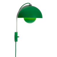 Modern green wall lamp with a chrome finish and a spherical green glass shade. Stylish and vibrant design.